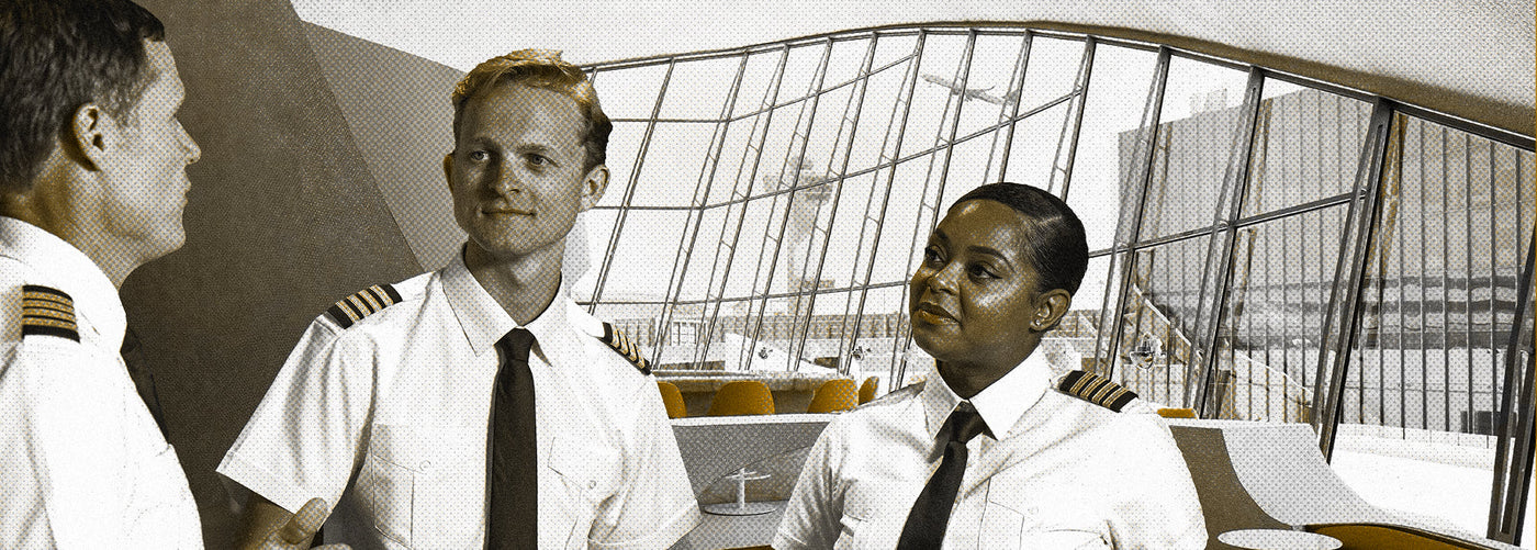 Two male pilots and a female pilot wearing epaulets and ties talking in an airport lounge area